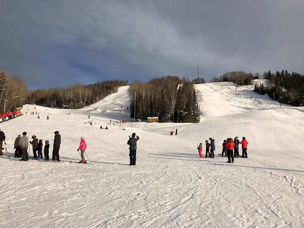 Mt Baldy Thunder Bay in Canada - a group of people standing on a snow covered slope.