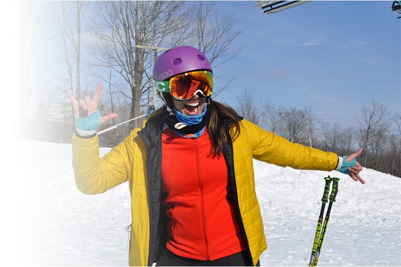 A skier is enjoying the slopes at Vallée du Parc in Mauricie, Shawinigan, Quebec, Canada. The scene embodies a lively winter sports environment.