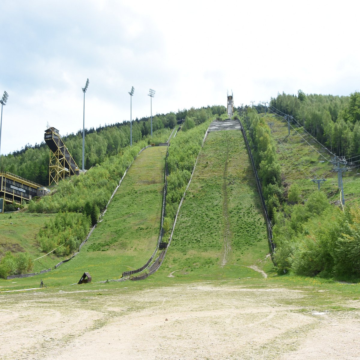 Čertova hora – Harrachov in Czech Republic - a ski lift going up the side of a hill.