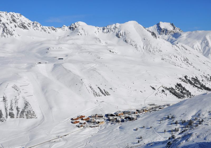 Ski resort in Kuhtai, Innsbruck region, Tyrol, Austria showcasing a challet against the backdrop of snow-covered slopes, perfectly designed for winter sports.