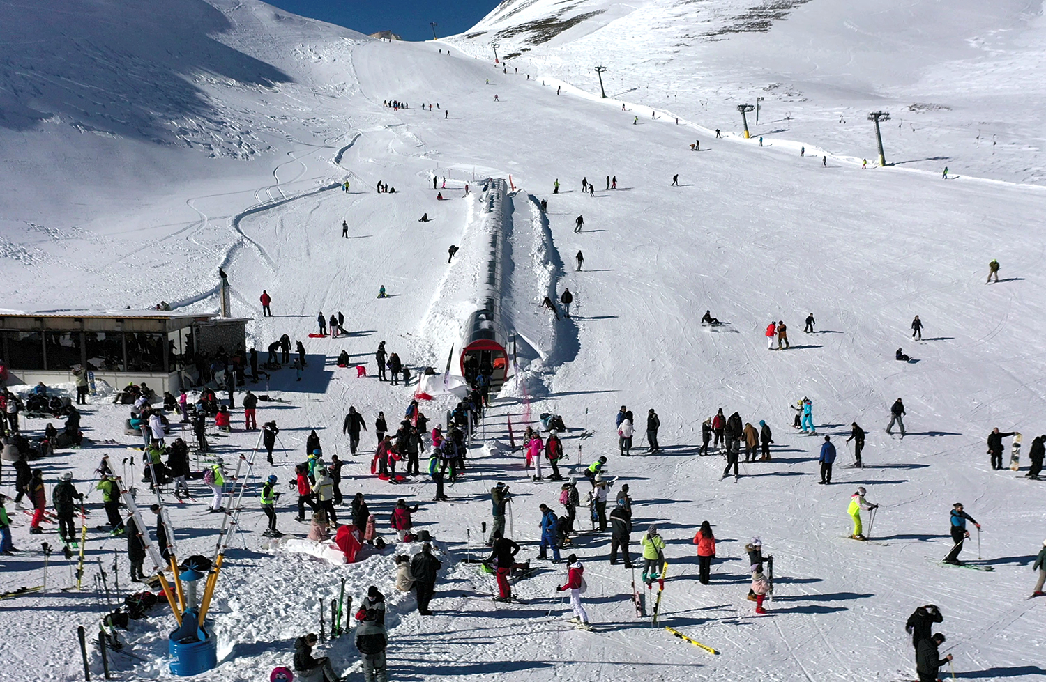 Velouchi Snow Centre S.A. in Greece - a large group of people skiing down a mountain.