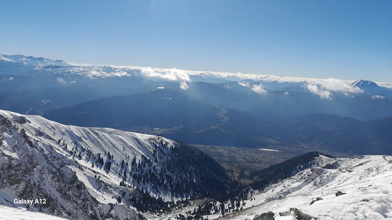 Velouchi Snow Centre S.A. in Greece - a view from the top of a snowy mountain.
