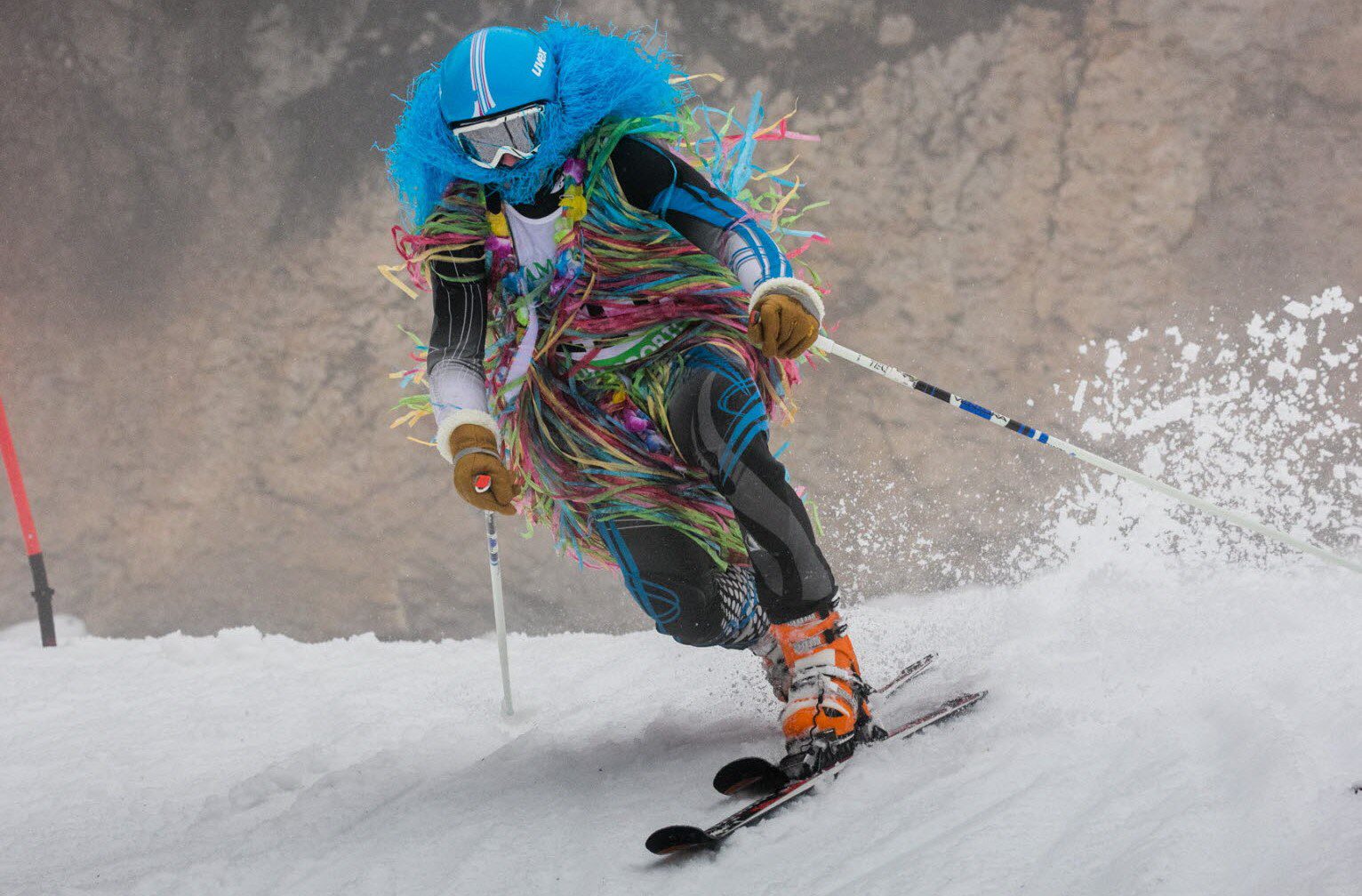 La Serra in France - a person in a colorful outfit skiing down a hill.