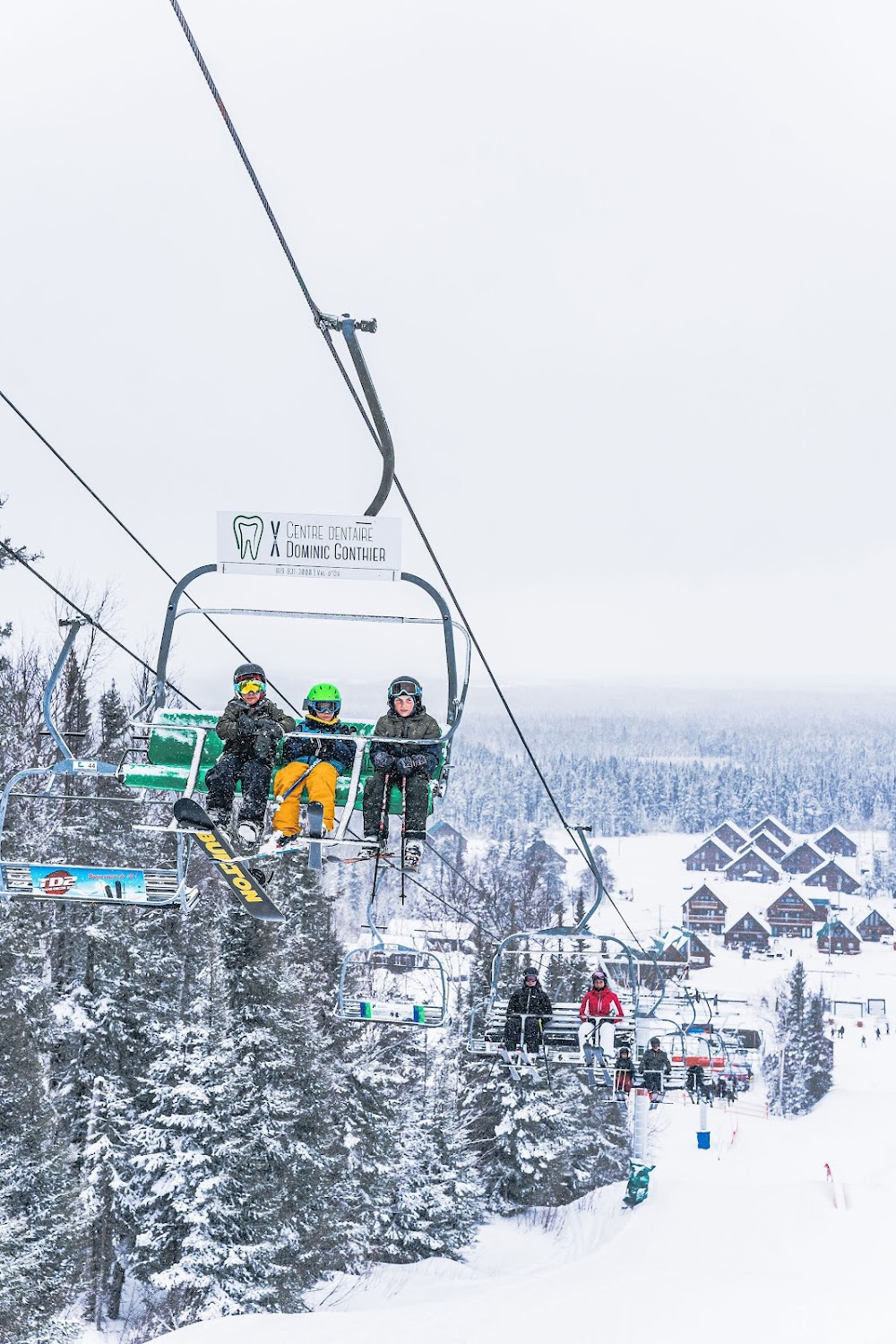 Mont-Vidéo in Canada - a person riding a ski lift in the snow.