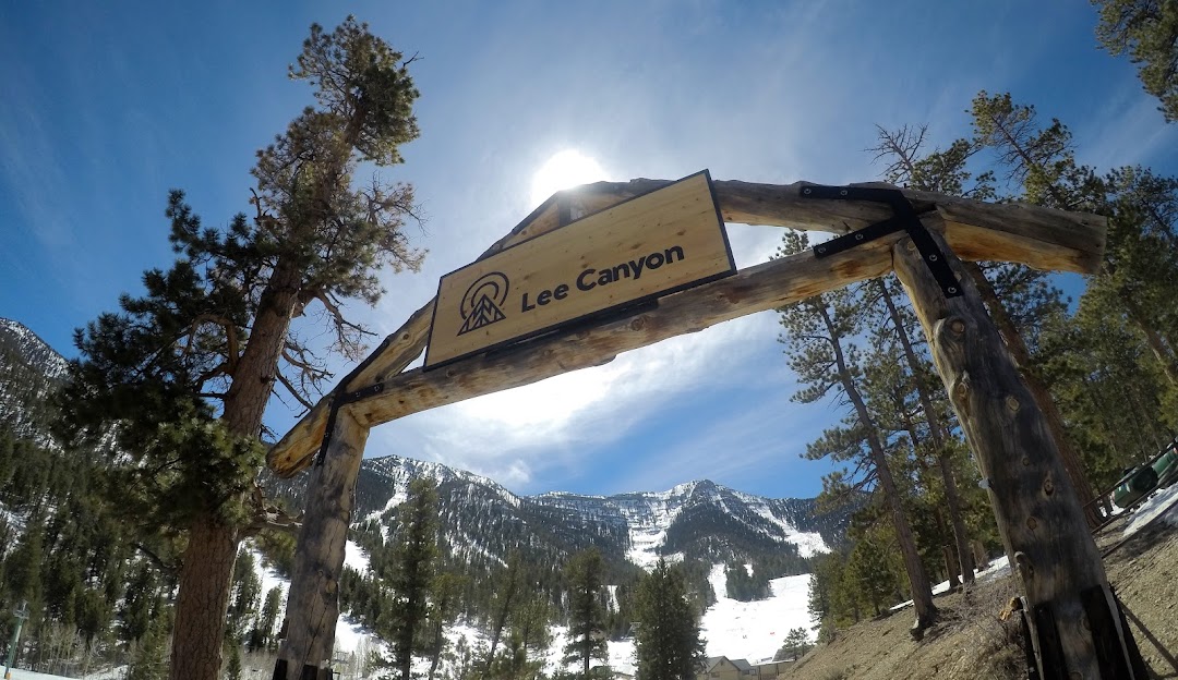 View of Lee Canyon in Las Vegas featuring a ski lift and resort with a charming lodge. This wintertime scene popular for winter sports showcases the unique combination of snow and desert landscapes.