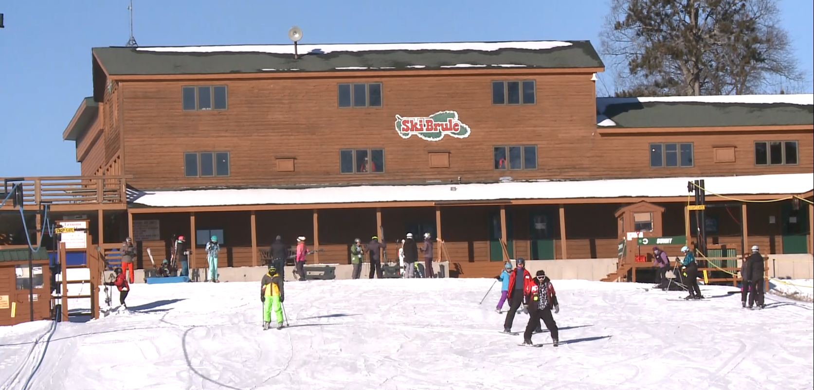 Ski Brule in USA - a group of people riding ski boards on a snowy slope.