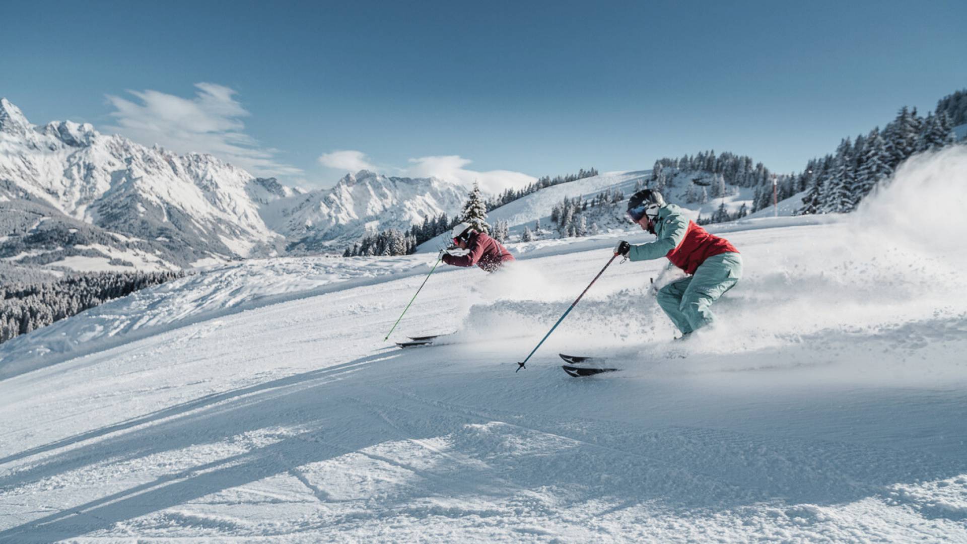 Winter sports scene at Hochkonigin in Hochkönig, Austria, featuring a skier and a group of people enjoying skiing at the resort.