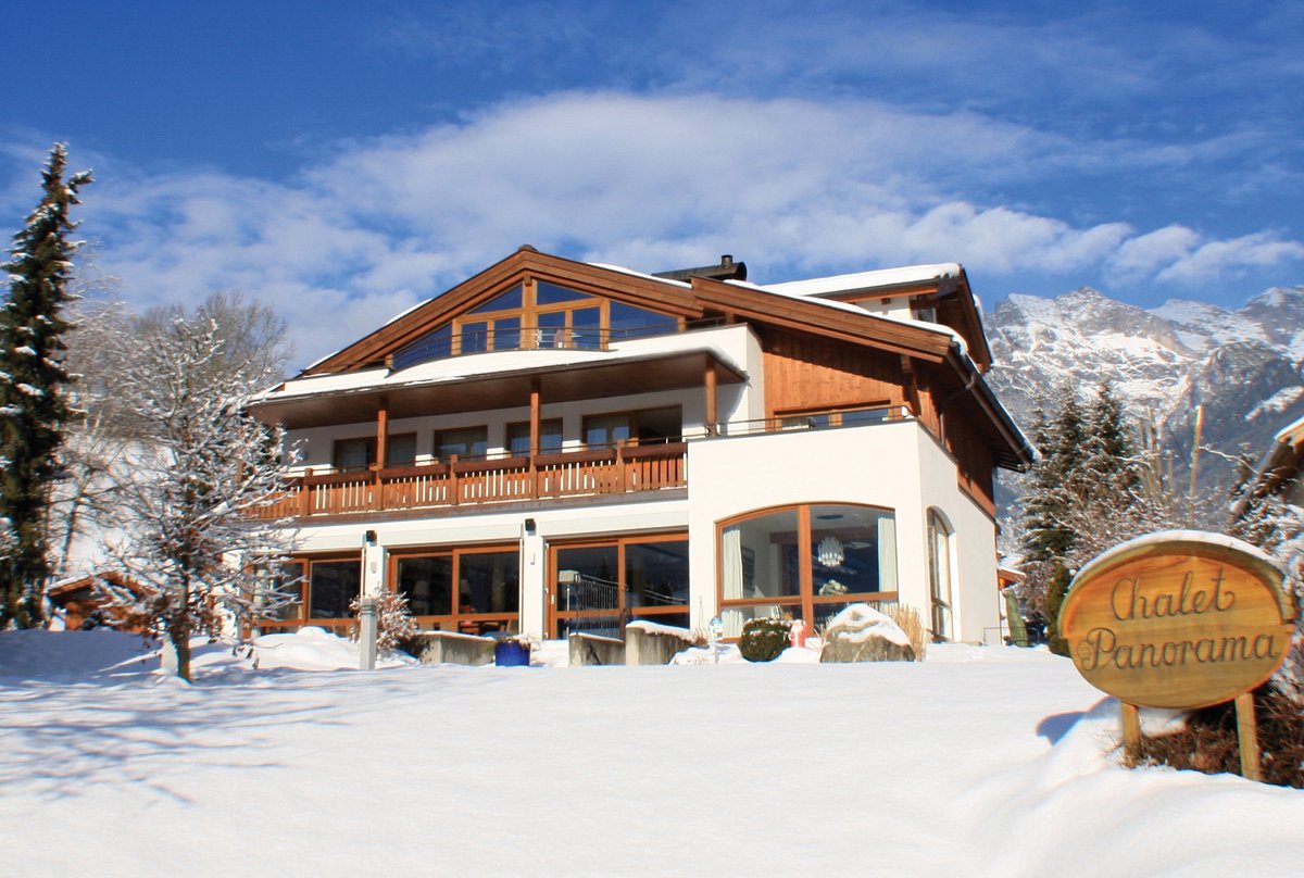 Hochkonigin in Austria - a house in the snow with mountains in the background.