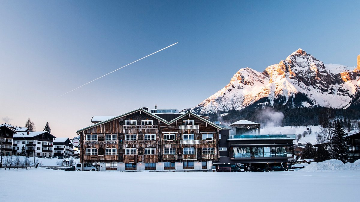Hochkonigin in Austria: a snow covered ski resort with mountains in the background.