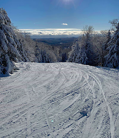 McCauley Mountain Ski Center in USA - a snow covered ski slope.