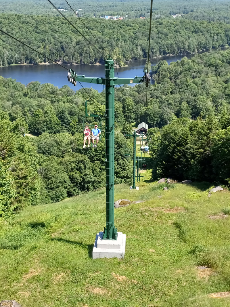 McCauley Mountain Ski Center in USA - a view of the lake from the top of a mountain.