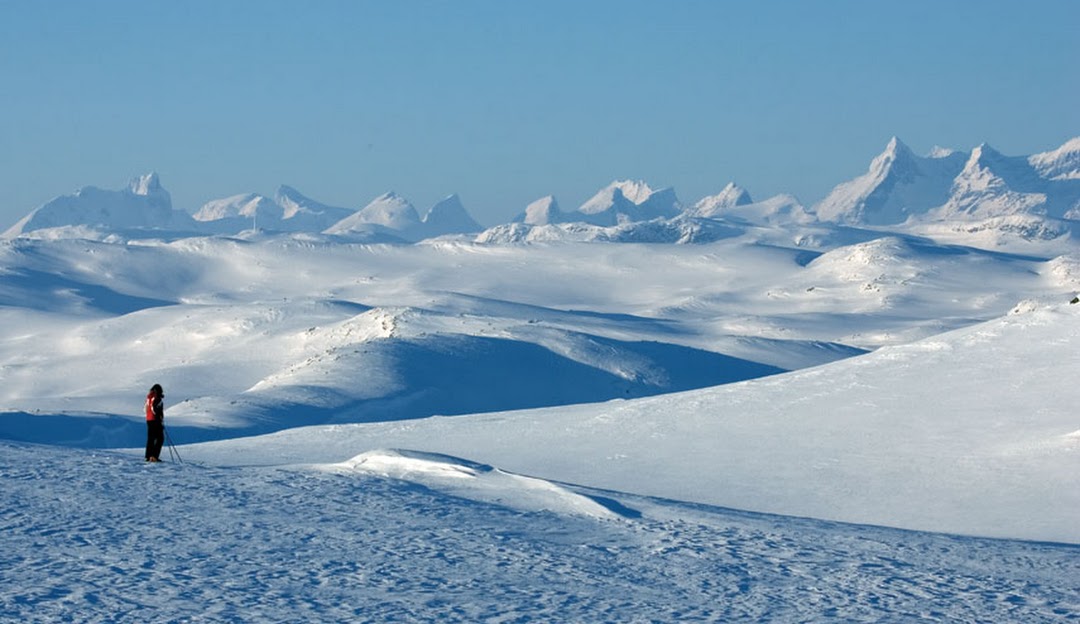Winter sports scene at Tyin-Filefjell in Valdres, Tyinkrysset, Oppland, Norway. Beautiful snowy slopes of the mountain create a picturesque winter scenery.