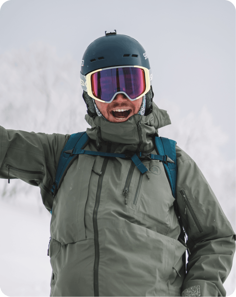 A skier navigates the snowy slopes at the Ski-Waldheimat Hauereck resort in Austria, with a snowboarder in the distance. The scene encapsulates the thrill of winter sports.