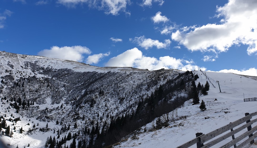 A picturesque chalet nestled in the Koralpe mountain range in Wolfsberg, Austria, surrounded by a stunning winter scenery and lively winter sports activities.