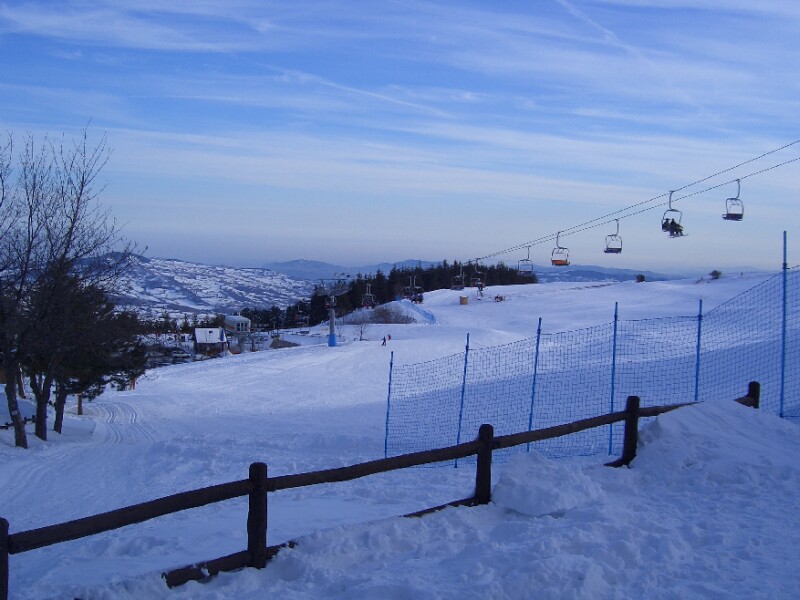 Picture of a challet at Risalita sciistica Carpegna - Eremo ski resort in Marche, Italy with a ski lift and winter sports scene visible.