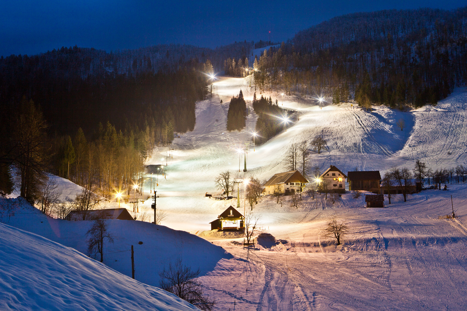 Javornik in Slovenia - a view of a ski slope at night.
