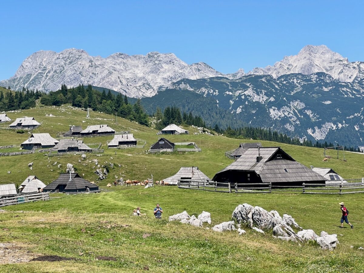 Velika Planina in Slovenia - a small village with mountains in the background.