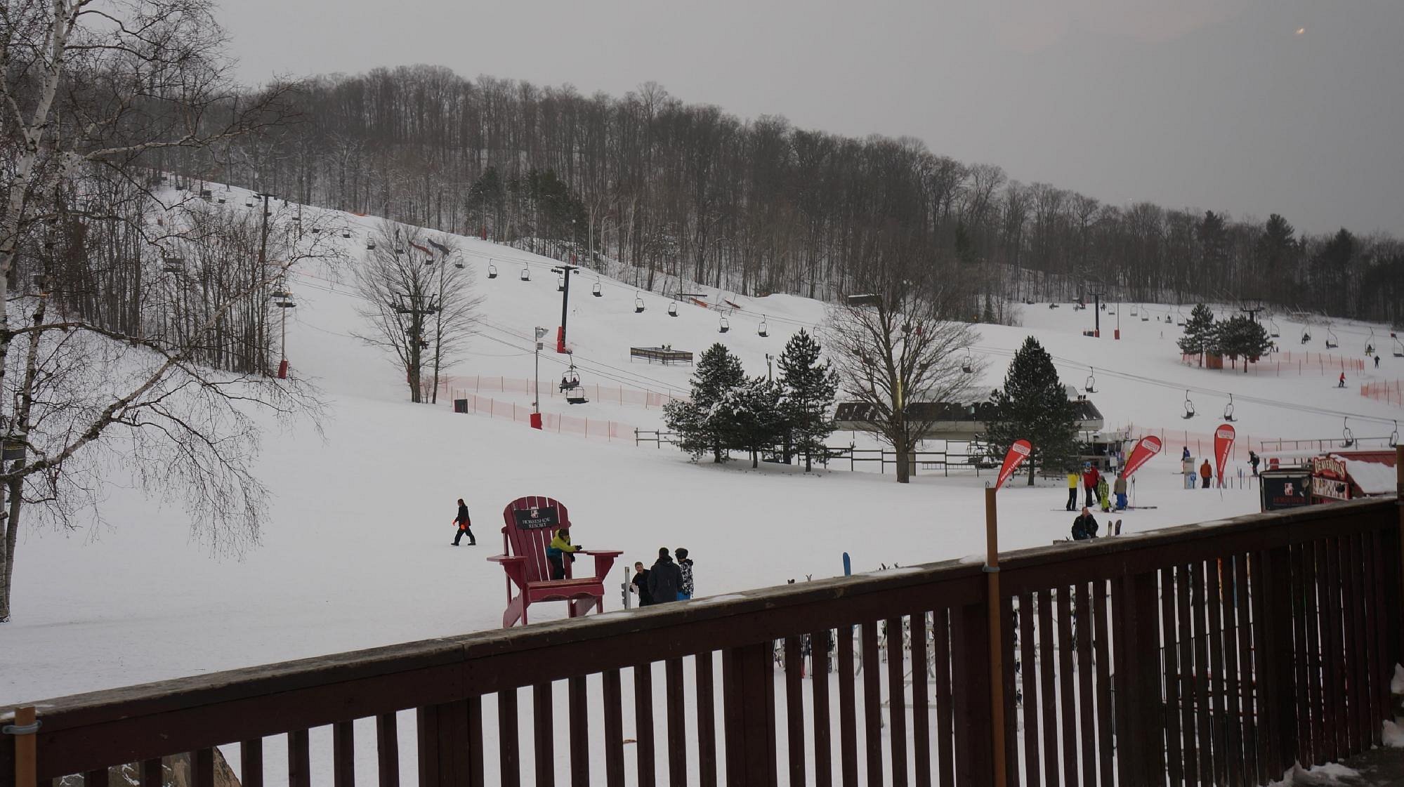 Winter sports scene at Horseshoe Resort in Barrie, Ontario, Canada. The picturesque environment includes a ski lift and stunning winter scenery.