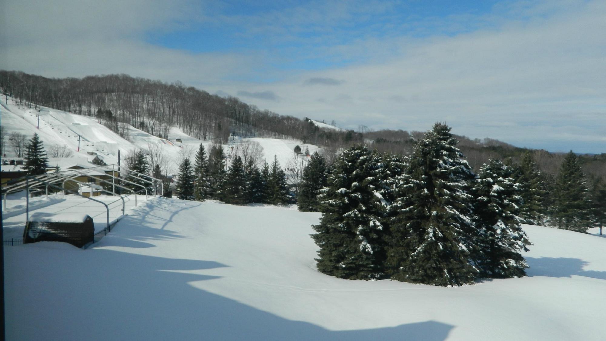 Winter sports scene at Horseshoe Resort in Barrie, Ontario, Canada featuring a charming chalet, picturesque winter scenery, and bustling ski resort.