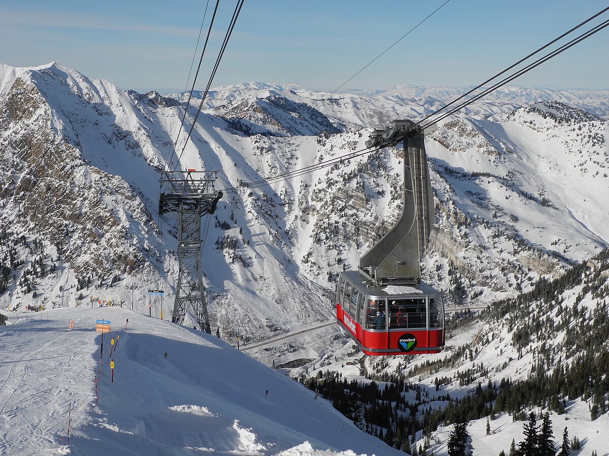 Snowbird in USA - a ski lift going up a snowy mountain.