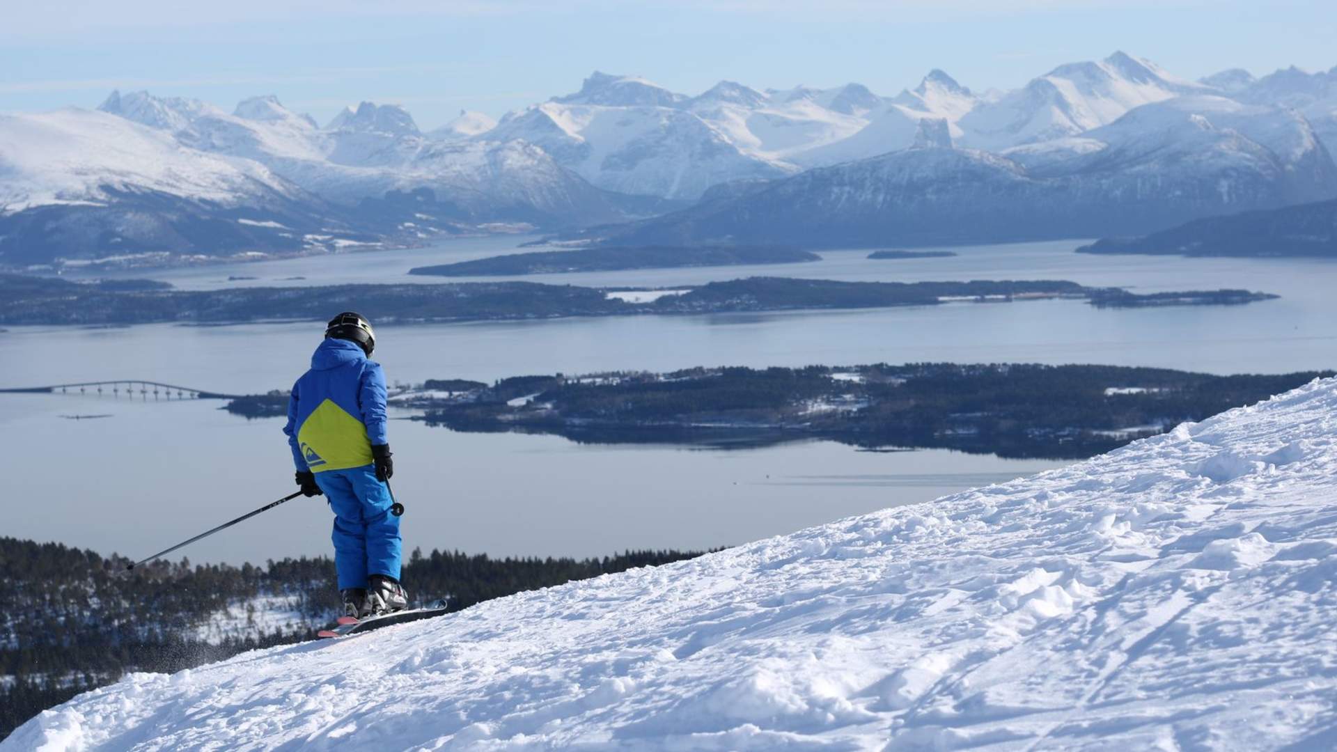 Tusten Skikro in Norway - a person standing on top of a snow covered mountain.
