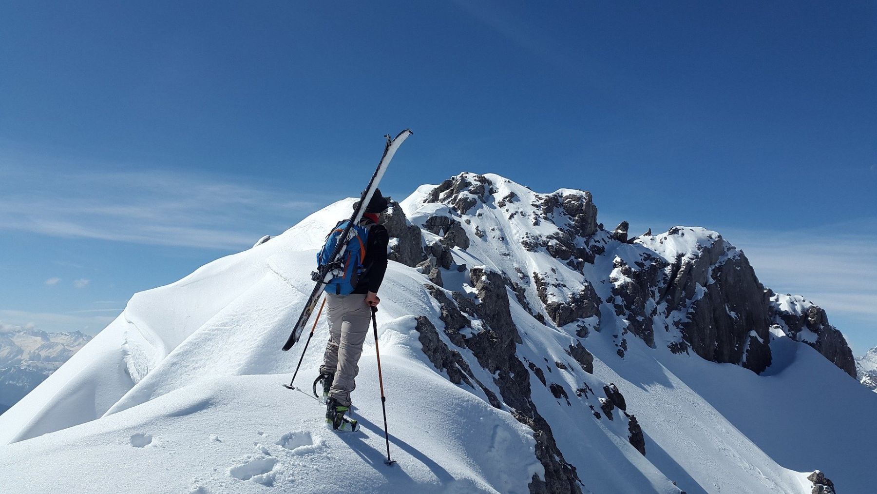 Passo dei Due Santi in Italy - a man standing on top of a snow covered mountain.