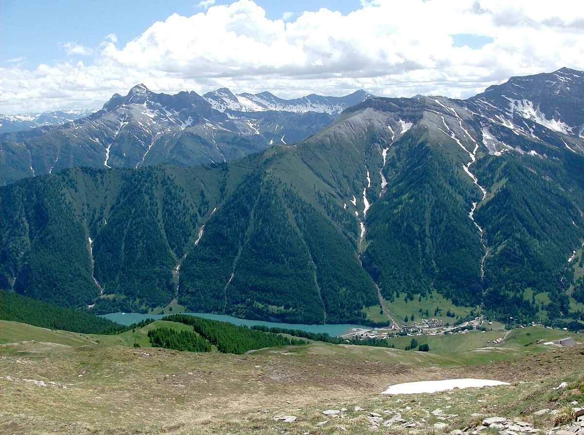 Pontechianale in Italy - the mountains are covered with snow.