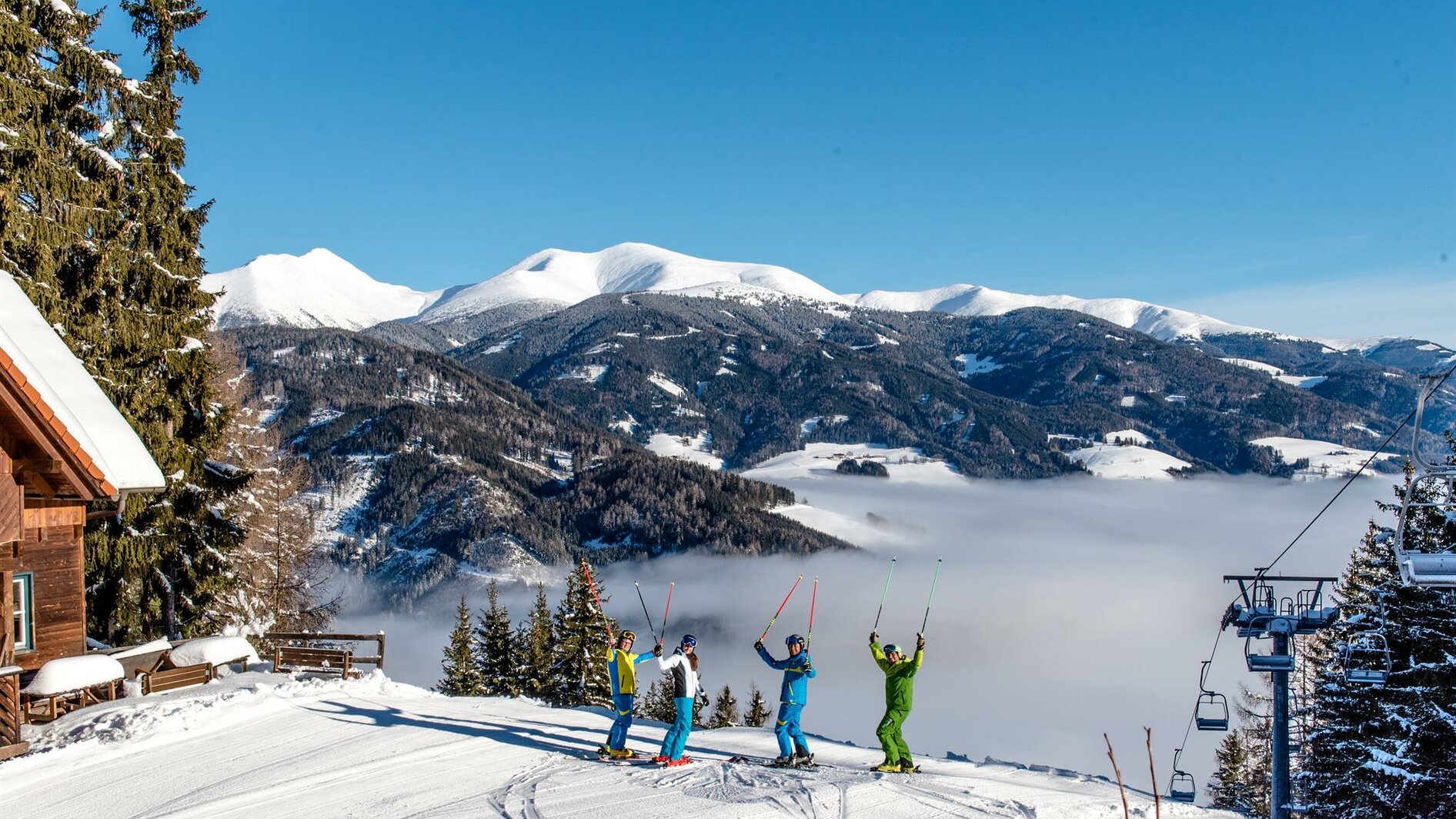 Gaaler Lifte in Austria - a group of people skiing down a snowy slope.