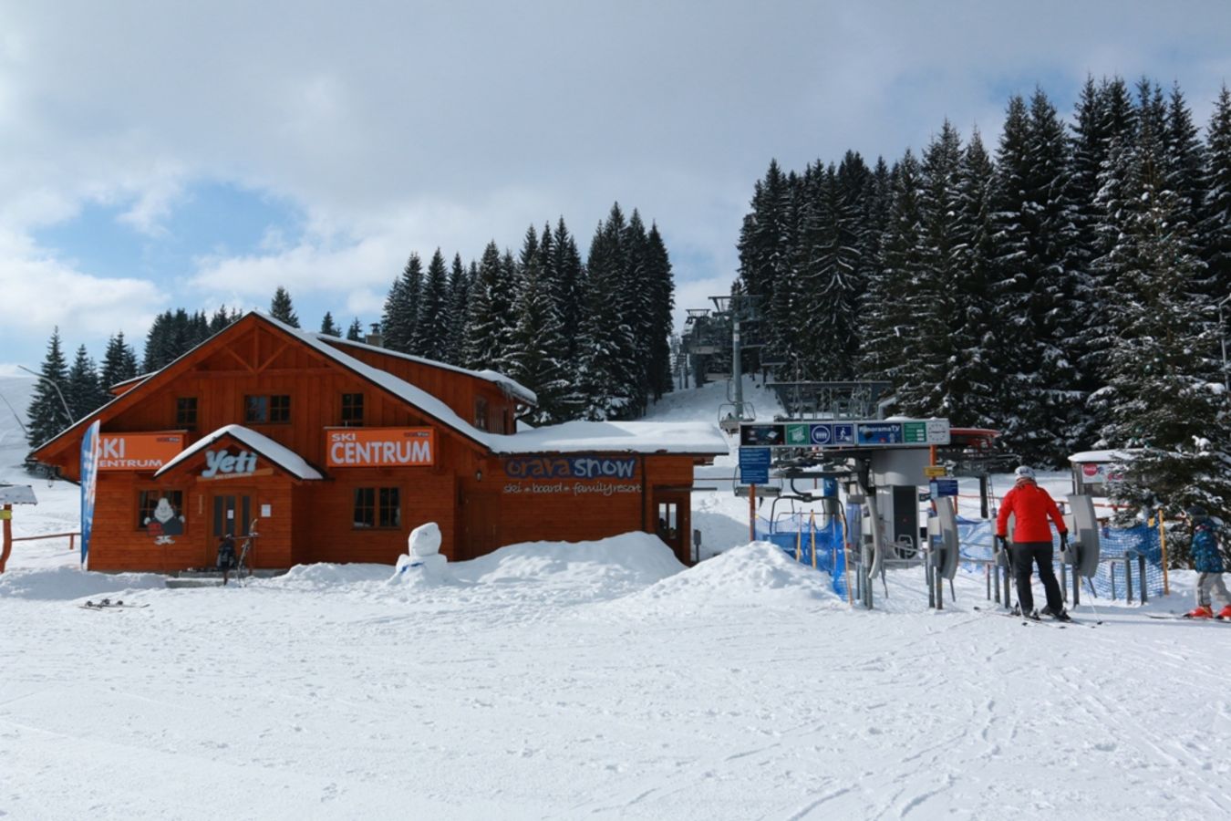 Orava Snow in Slovakia - a group of people standing in the snow.