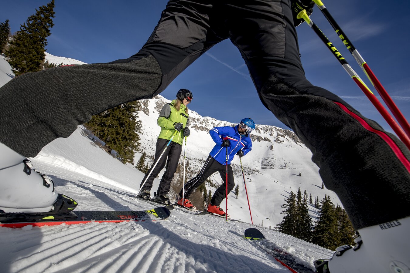 Brunnalm - Hohe Veitsch in Austria - two people standing on the snow with ski poles.