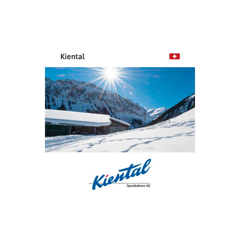 Kiental in Switzerland: a picture of a ski resort with the sun in the background.