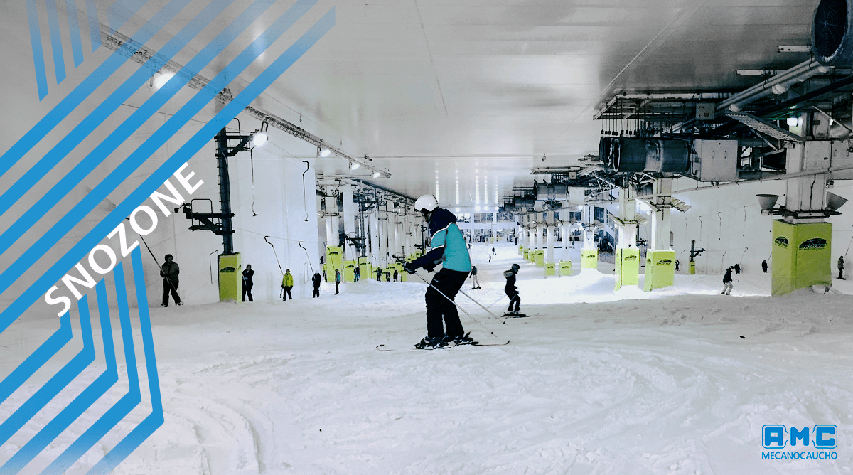 Snozone – Milton Keynes in United Kingdom - a group of people skiing down a snow covered slope.
