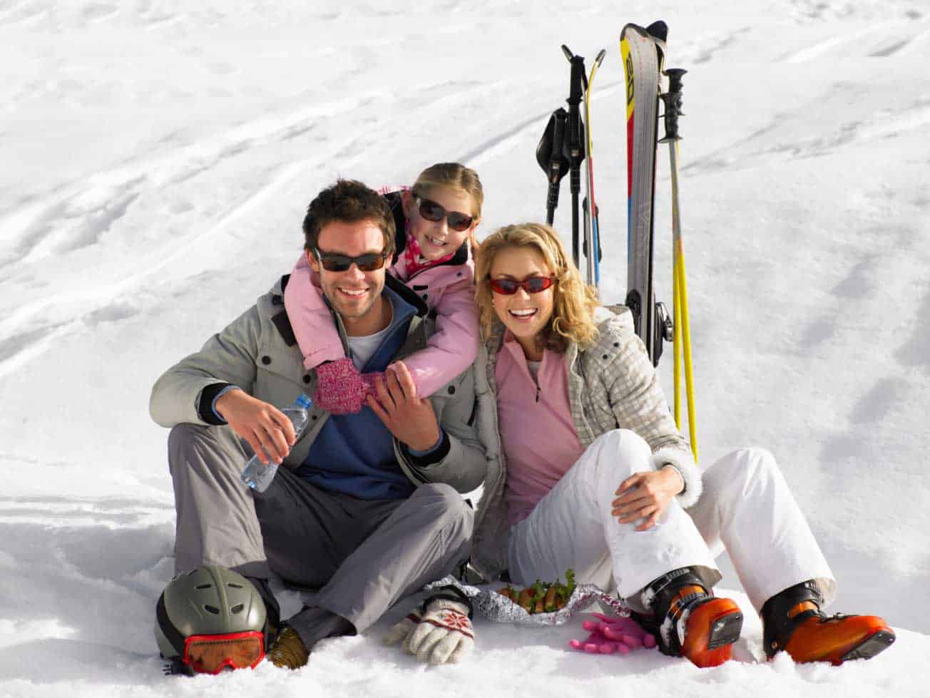 Cataloochee in USA - a man and woman sitting in the snow.
