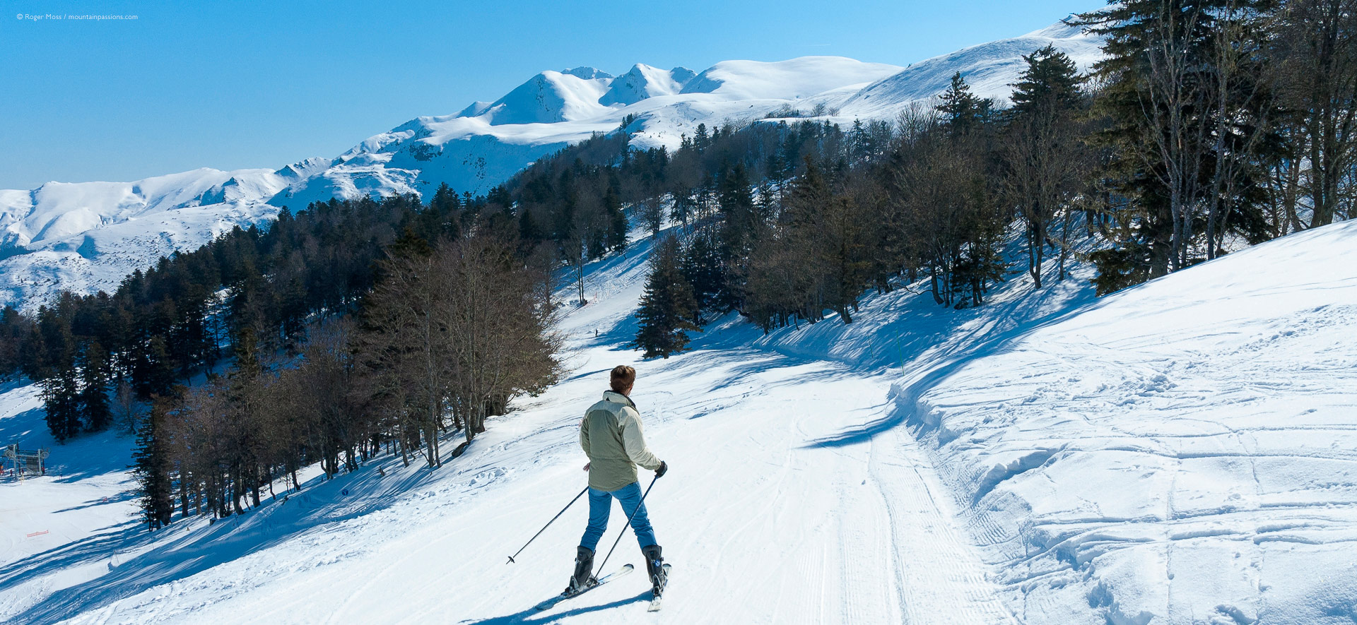 Hautacam in France - a man riding skis down a snowy slope.