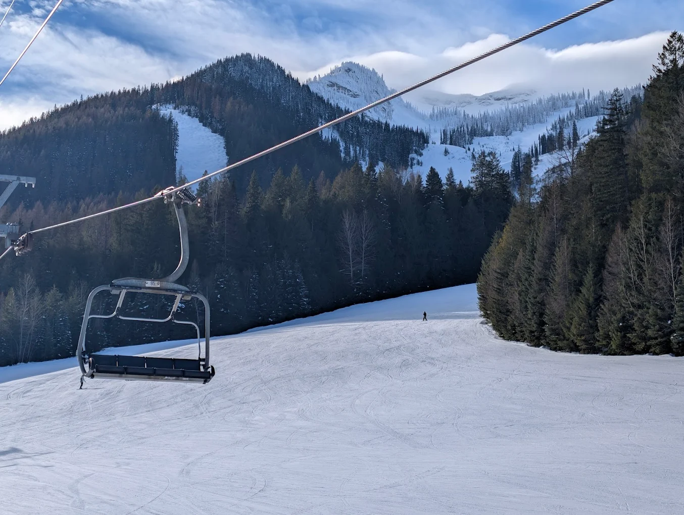 Fernie in Canada - a ski lift going up a snowy slope.