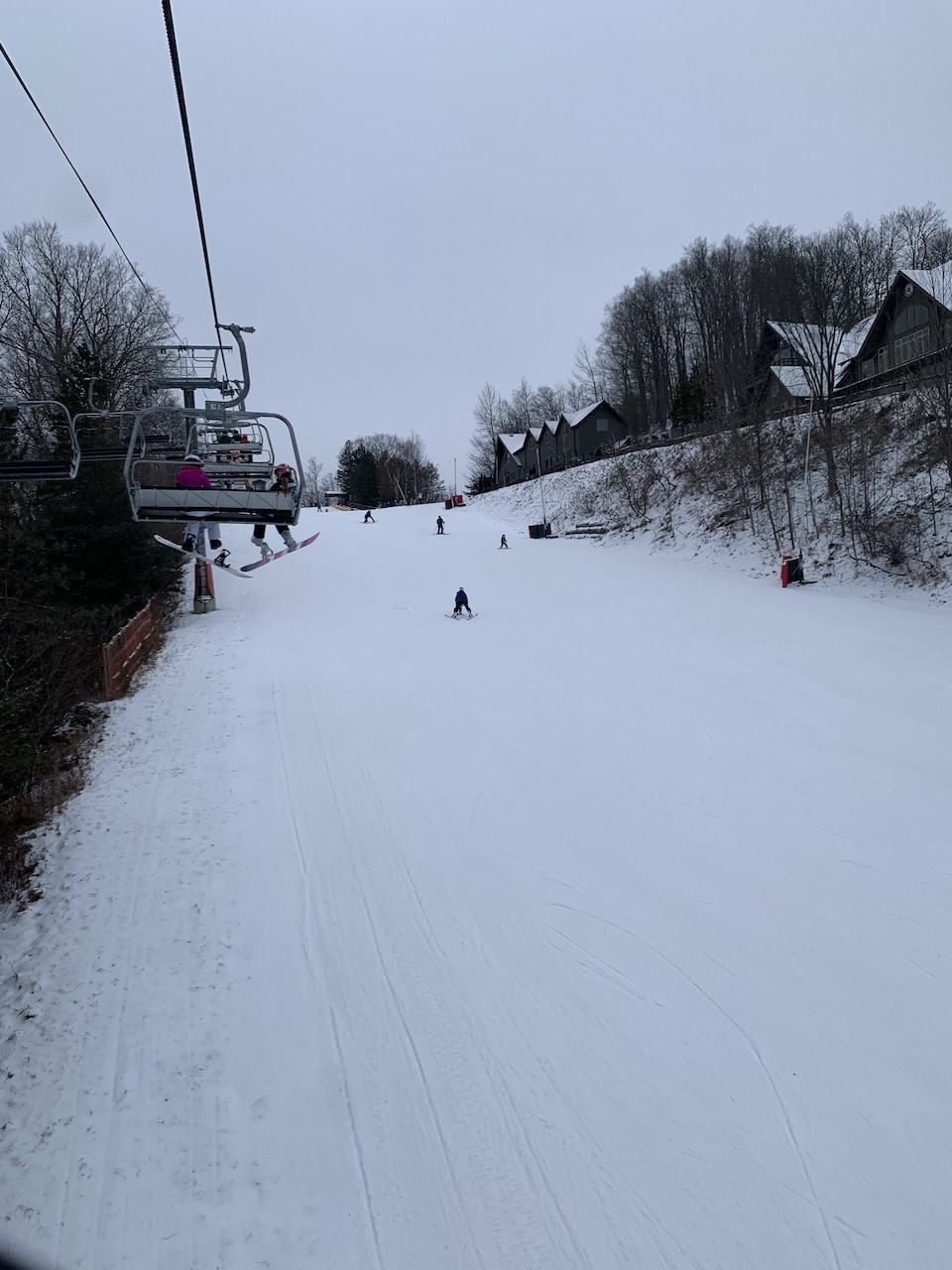 Caledon Ski Club in Canada - a person riding a ski board down a snowy slope.