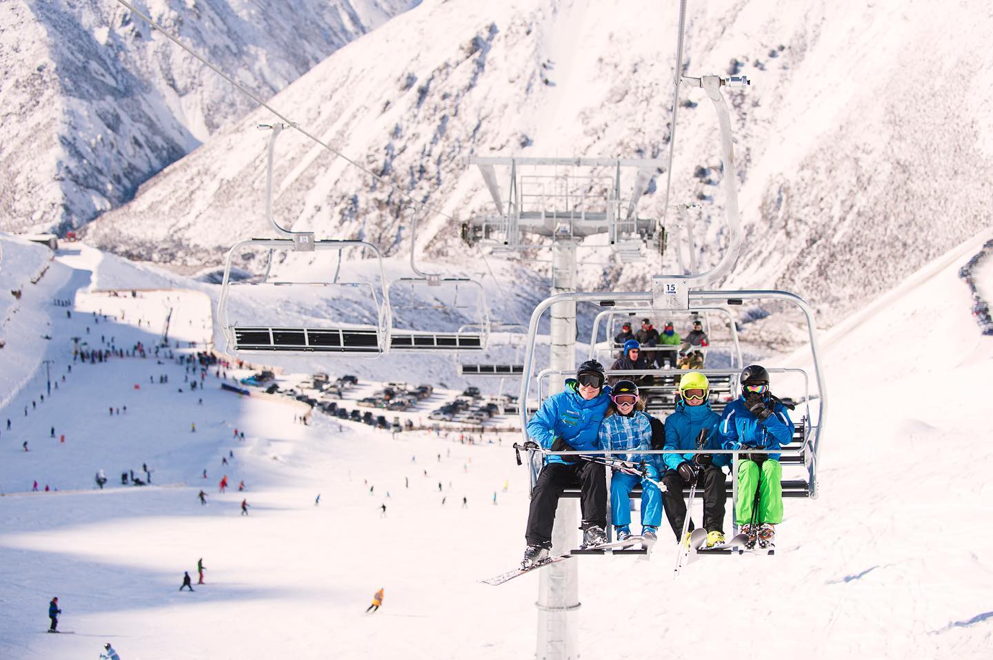 Porters in New Zealand - a group of people riding a ski lift.