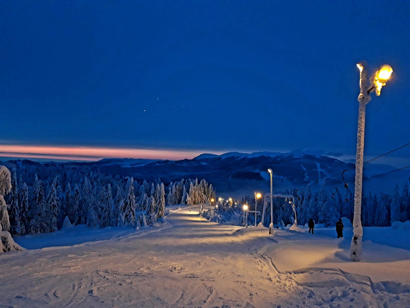 Superski Roata Cavnic in Romania - a ski slope covered in snow at night.