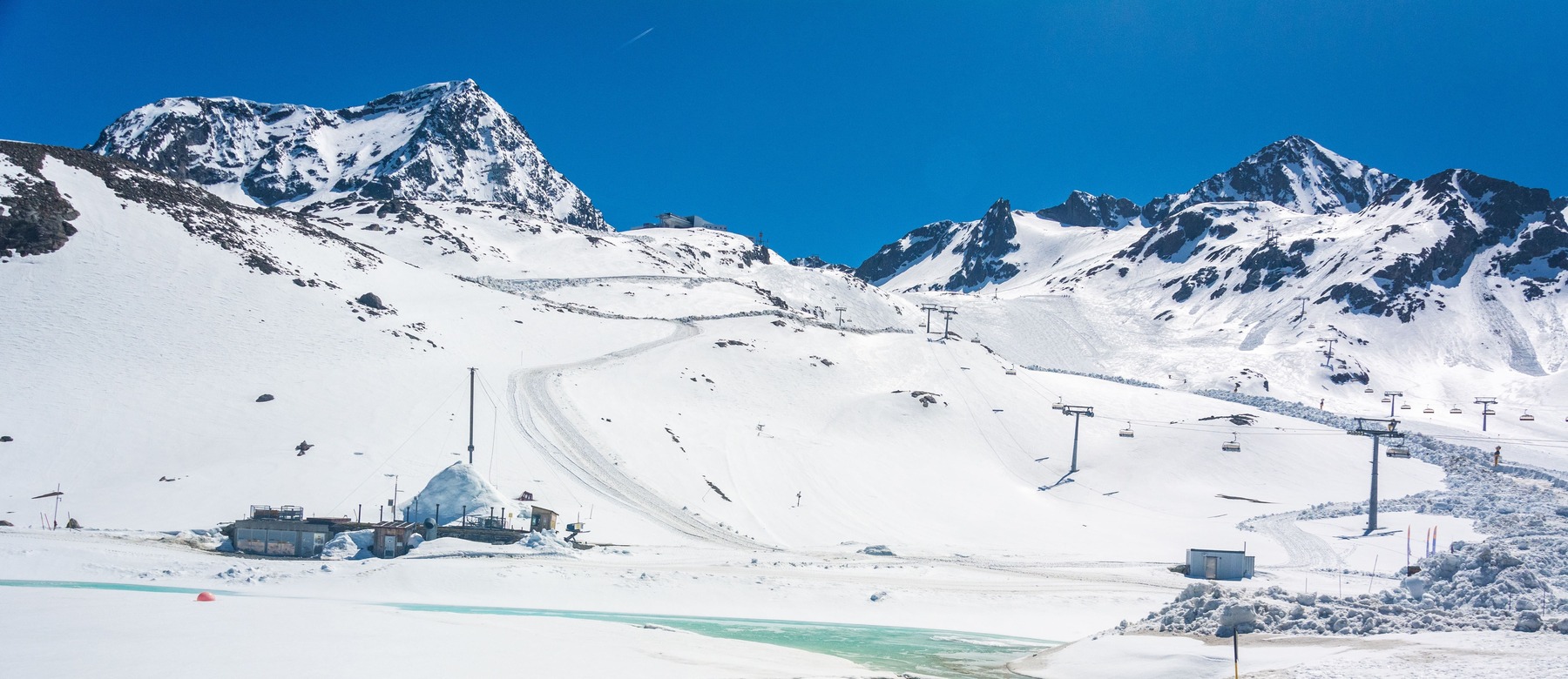 Stubai Glacier in Austria - a view of a snowy mountain with a ski lift.