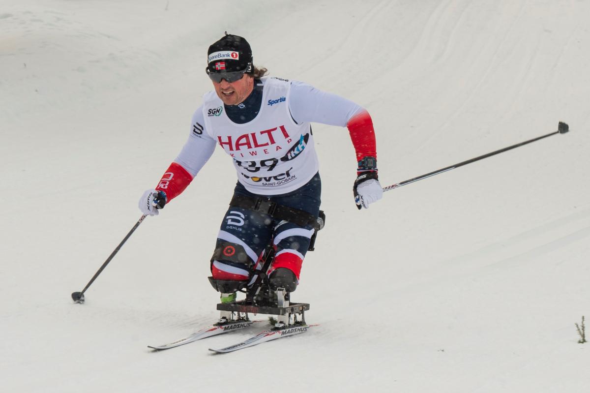 Vuokatti in Finland - a skier skiing down a slope in the snow.