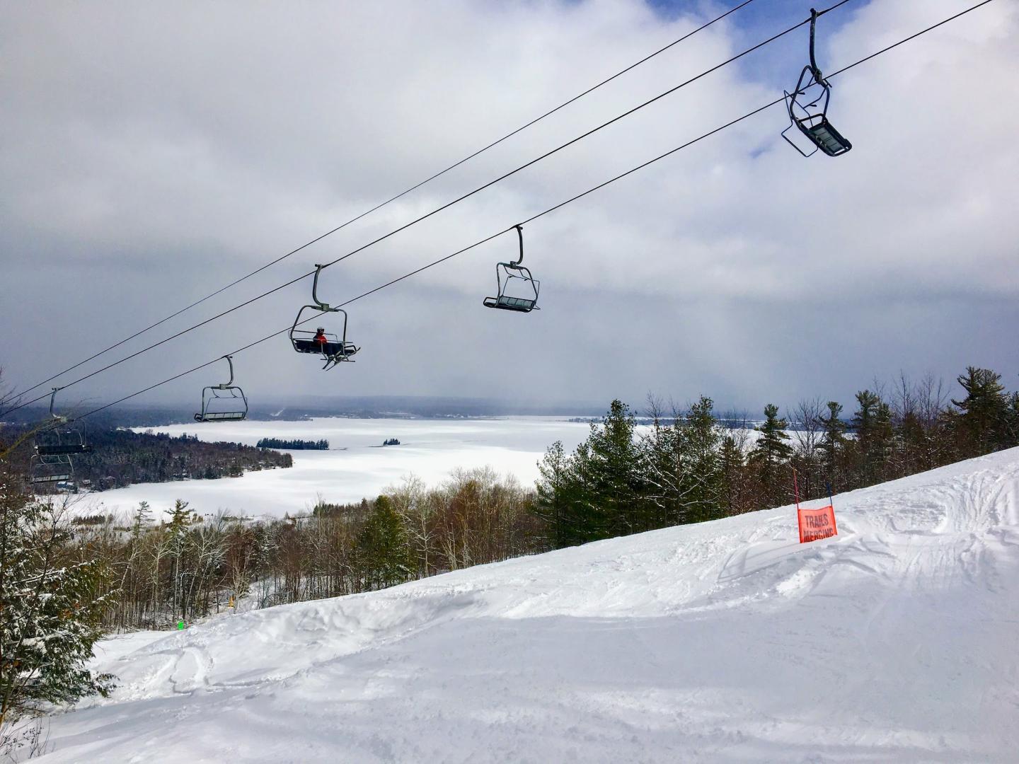 Calabogie Peaks in Canada - a ski lift going up a snowy hill.