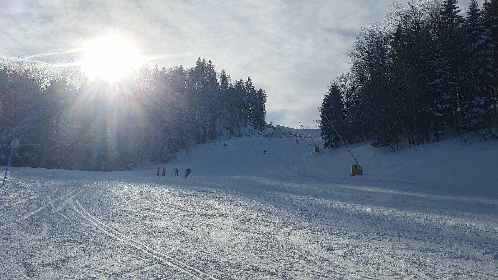 Igrišta in Bosnia and Herzegovina - a group of people skiing down a mountain.