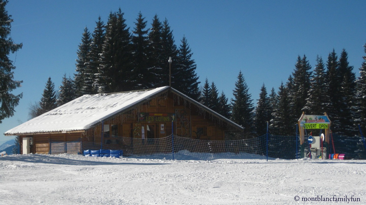 View of Passy Plaine-Joux in France featuring a bustling winter sports centre, with scenic chalets and lodges dotted among the snow-dusted ski resort.