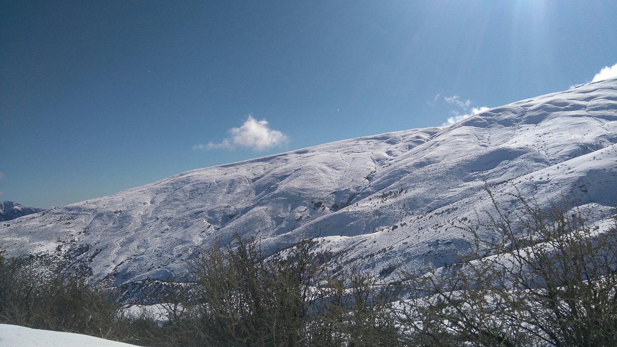 Lagunillas del Cajón del Maipo in Chile - a view of the mountains from the top of a hill.