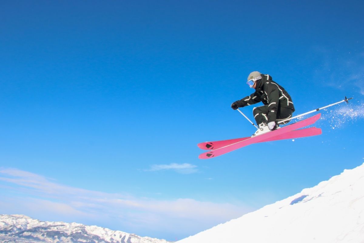 Hakkai Sanroku Ski Area in Japan - snowboarder in the air.