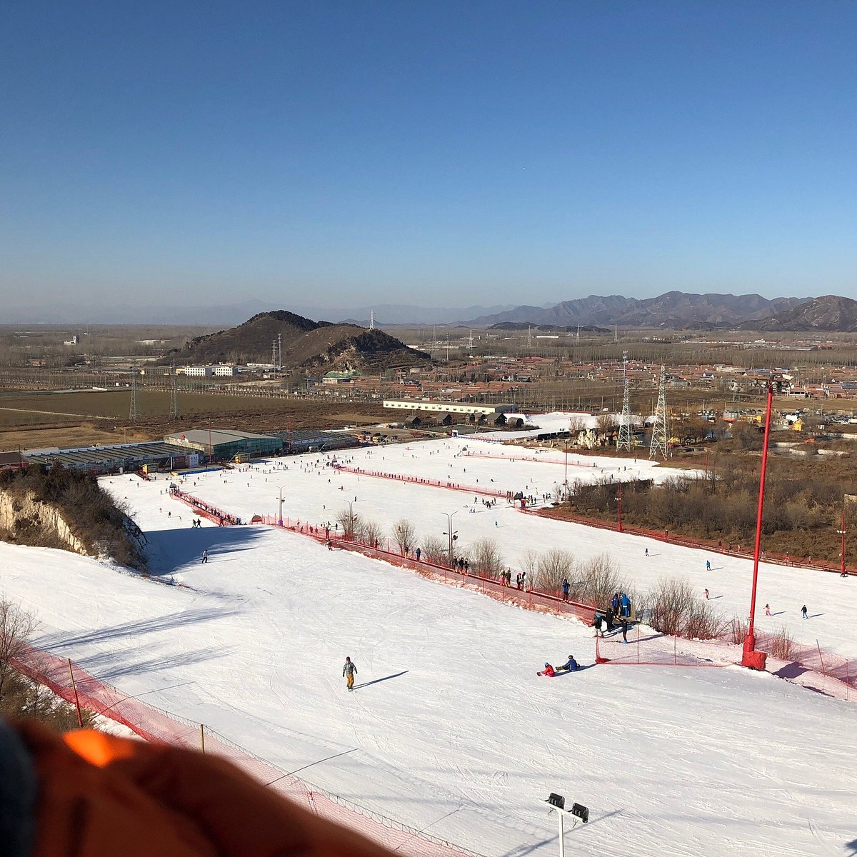 Lianhuashan Ski Resort in China - a view from the top of a ski slope.