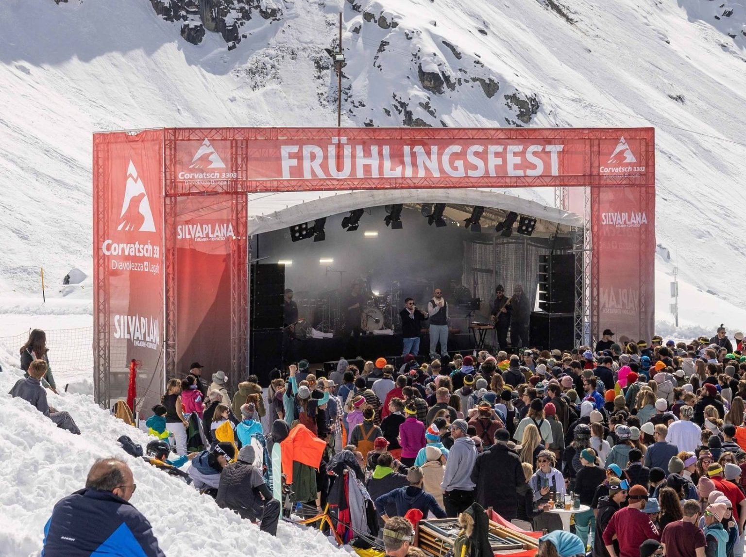 Corvatsch | Furtschellas in Switzerland - a crowd of people standing in front of a stage.