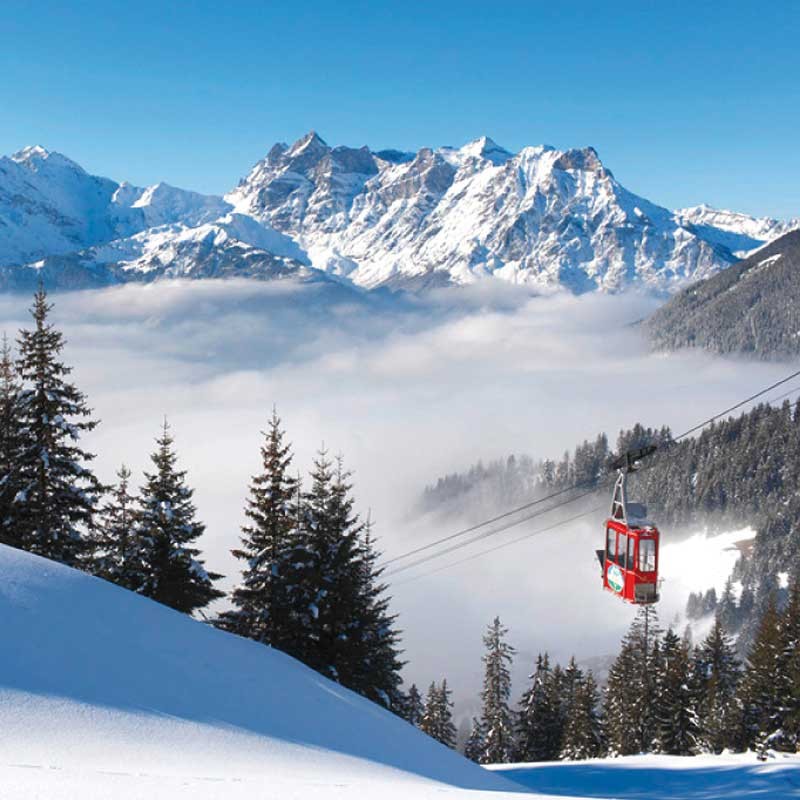Biel-Kinzig in Switzerland - a ski lift going up a snowy mountain.