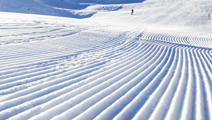 Sportbahnen Gampel-Jeizinen in Switzerland - a person skiing down a snow covered slope.