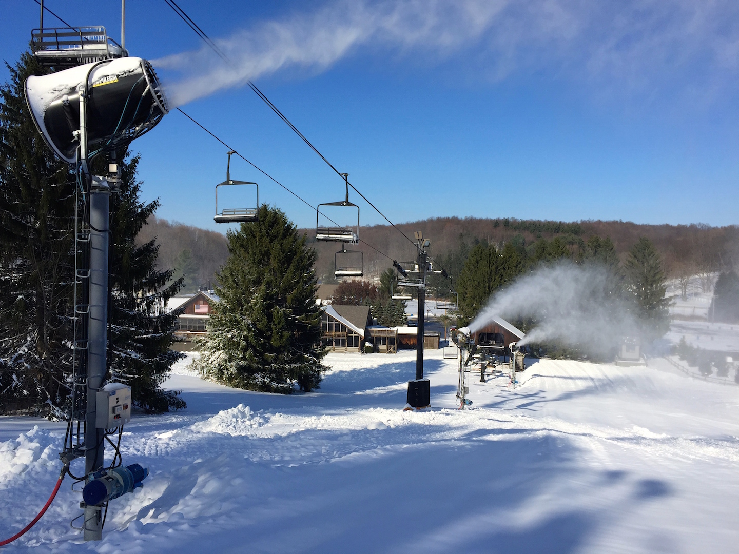 Snow Trails in USA - a ski lift going up a hill in the snow.